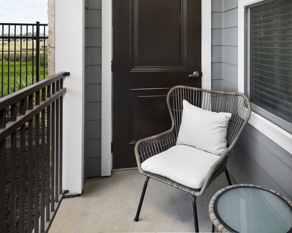 Relaxing patio with outdoor seating at Sapphire Bay Apartments