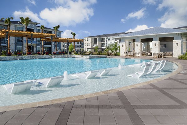 Resort-style swimming pool at Sapphire Bay Apartments offering luxury relaxation