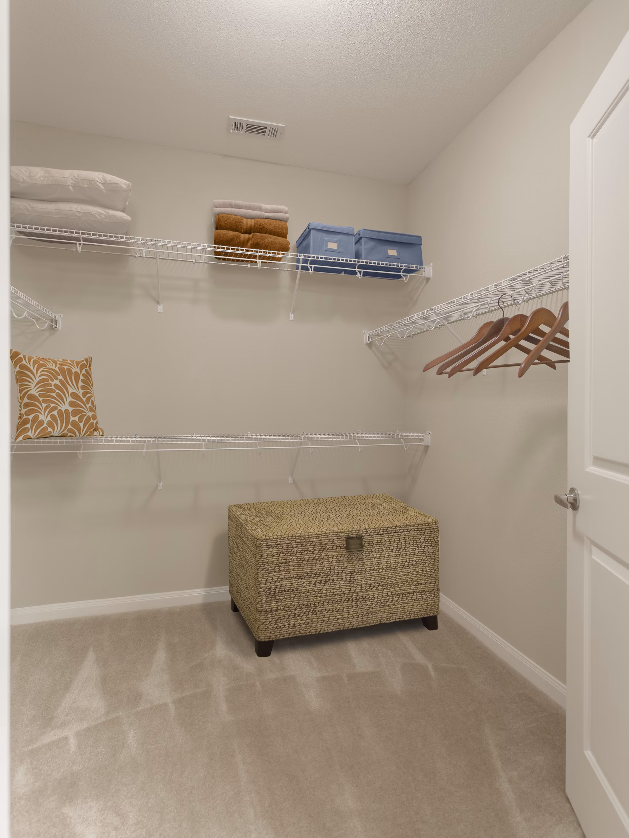 Walk-in closet with built-in shelves at Arlo Buffalo Heights Apartments, offering ample storage space in modern luxury apartments