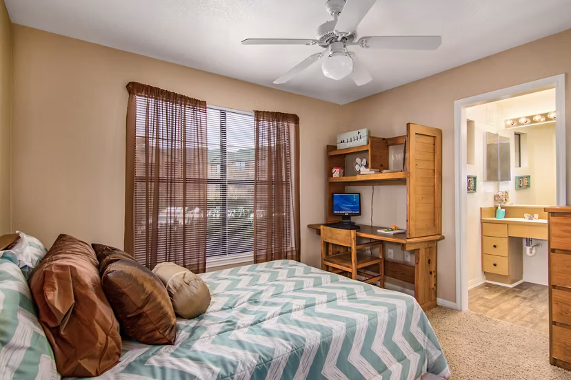 Spacious bedroom with contemporary design at Reveille Ranch Apartments