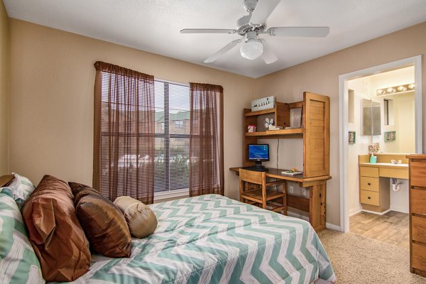 Spacious bedroom with contemporary design at Reveille Ranch Apartments