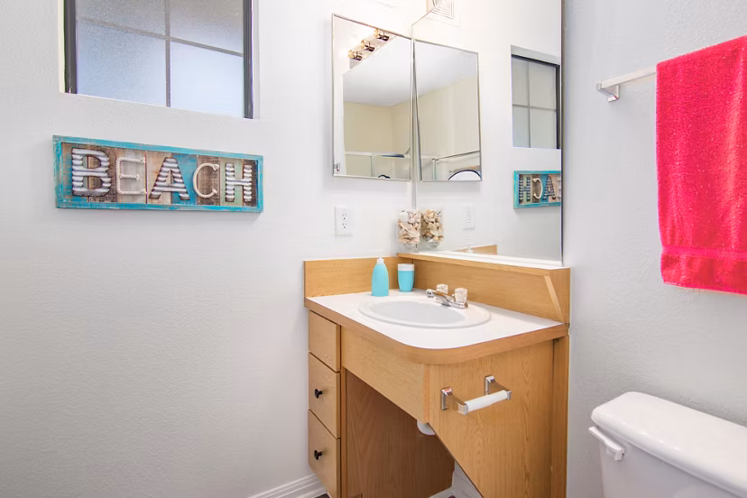 Modern bathroom with sleek fixtures at Reveille Ranch Apartments offering luxury living experience