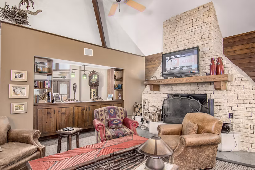 Modern clubhouse with entertainment space at Reveille Ranch Apartments, offering luxury amenities for residents