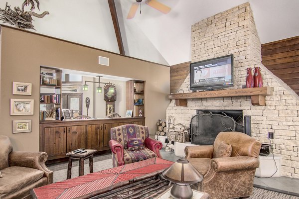 Modern clubhouse with entertainment space at Reveille Ranch Apartments, offering luxury amenities for residents
