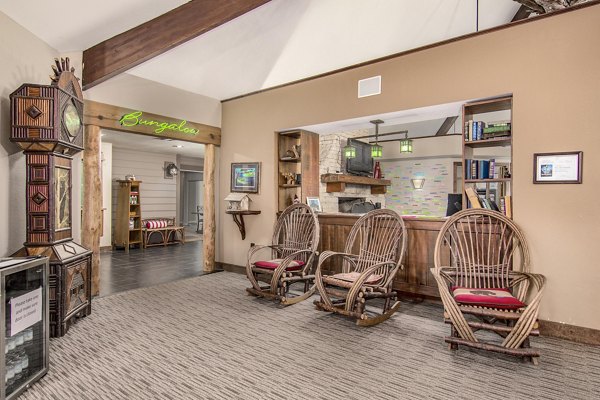 Clubhouse with modern design and comfortable seating at Reveille Ranch Apartments