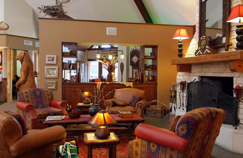 Modern clubhouse featuring cozy seating and billiards at Reveille Ranch Apartments