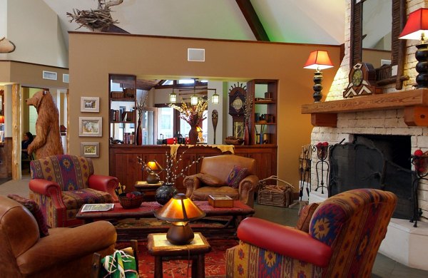 Modern clubhouse featuring cozy seating and billiards at Reveille Ranch Apartments
