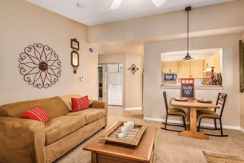 Spacious living room with modern decor at Reveille Ranch Apartments, offering comfort and style in luxury Greystar apartments