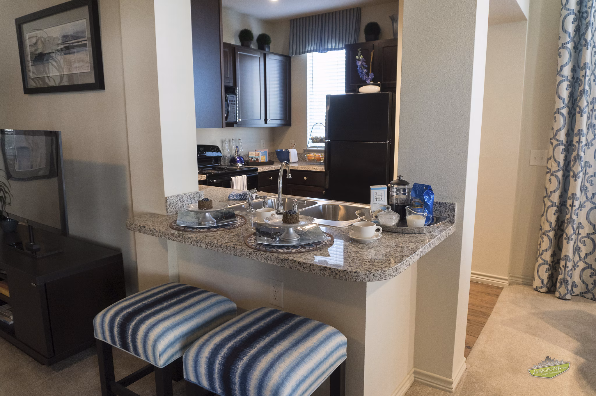Modern kitchen with stainless steel appliances in 21 Gramercy Park Apartments