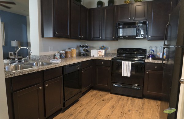 Contemporary kitchen with stainless steel appliances at 21 Gramercy Park Apartments