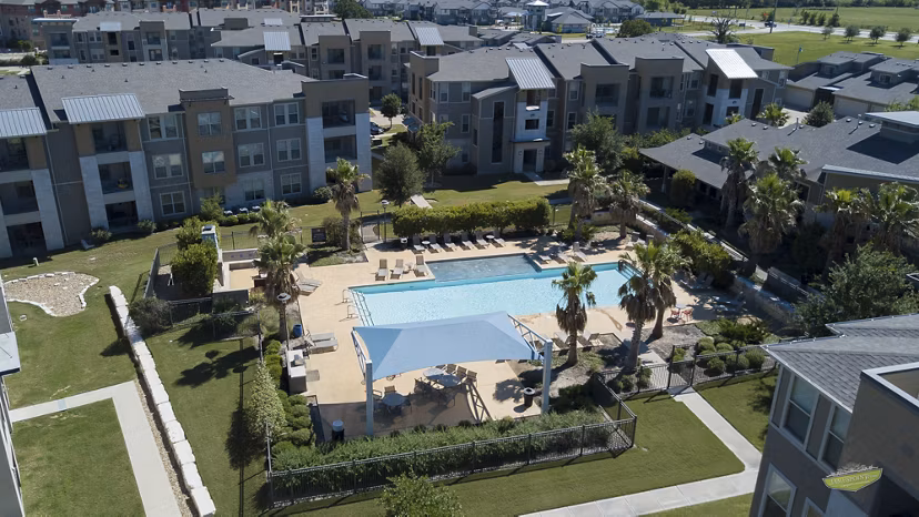 Pool with elegant lounge chairs at 21 Gramercy Park Apartments, Greystar luxury apartments in desirable location
