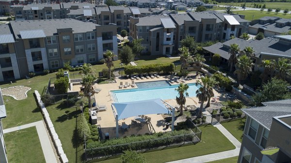 Pool with elegant lounge chairs at 21 Gramercy Park Apartments, Greystar luxury apartments in desirable location