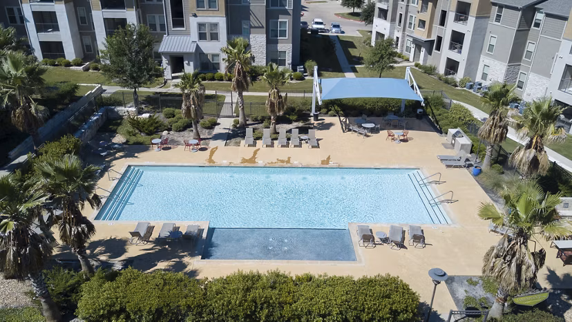 Luxurious pool with lounge chairs at 21 Gramercy Park Apartments, a Greystar luxury community