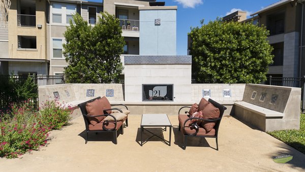 Cozy outdoor fire pit area at 21 Gramercy Park Apartments, perfect for relaxed evenings in luxury surroundings