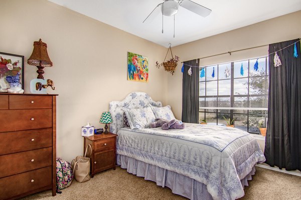 Elegant bedroom with queen bed and stylish decor at The Ridge Apartments