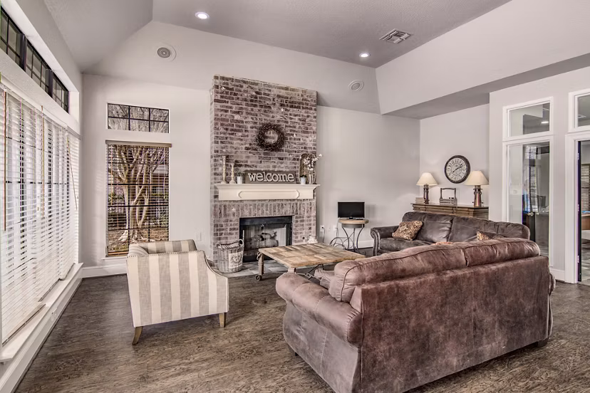 Modern clubhouse with cozy seating and sleek design at The Ridge Apartments, perfect for social gatherings and relaxation