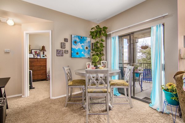 Dining area featuring modern furniture and elegant lighting at The Ridge Apartments