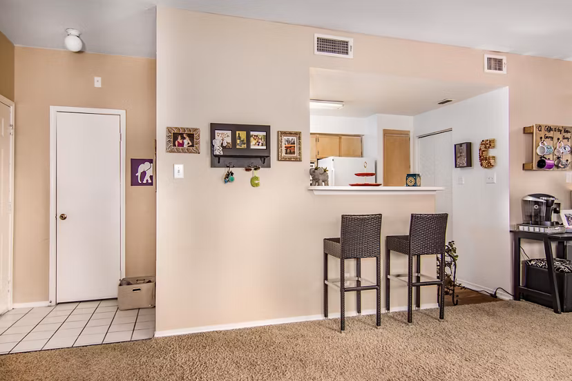 Dining area featuring modern decor and large windows at The Ridge Apartments, providing a luxurious living experience