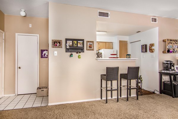 Dining area featuring modern decor and large windows at The Ridge Apartments, providing a luxurious living experience