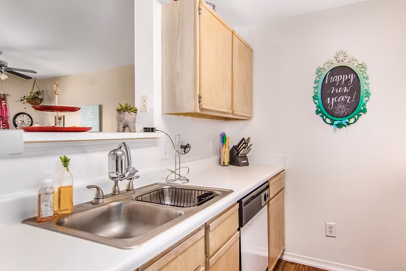 Modern kitchen with stainless steel appliances at The Ridge Apartments, a Greystar luxury community