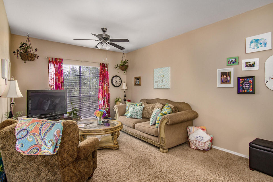 Spacious living room with modern decor in The Ridge Apartments, providing comfort and style for luxury living