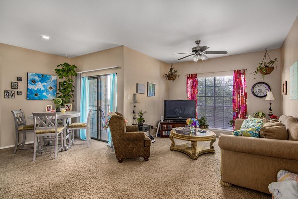 Spacious living room with contemporary furnishings at The Ridge Apartments, Greystar luxury apartments