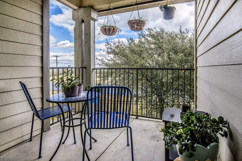 Cozy outdoor patio with modern furniture at The Ridge Apartments, ideal for relaxing and entertaining in a luxury setting