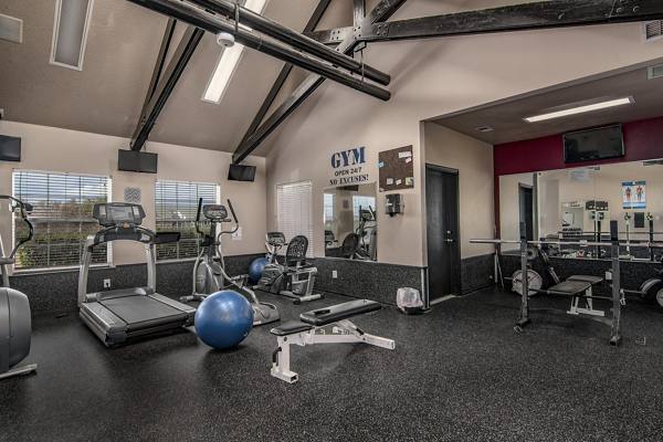 fitness center at The Trails at Wolf Pen Apartments