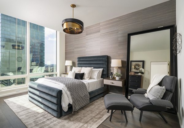 THEA at Metropolis: Elegant bedroom with contemporary design and city views in luxury apartments