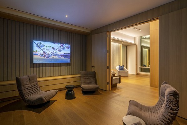 Clubhouse featuring modern design elements at THEA at Metropolis Apartments, a Greystar luxury living community in Los Angeles