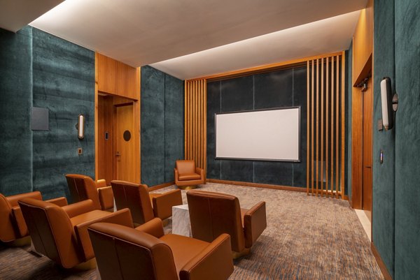 Modern theater with plush seating at THEA at Metropolis Apartments, perfect for luxury entertainment experiences in the heart of the city