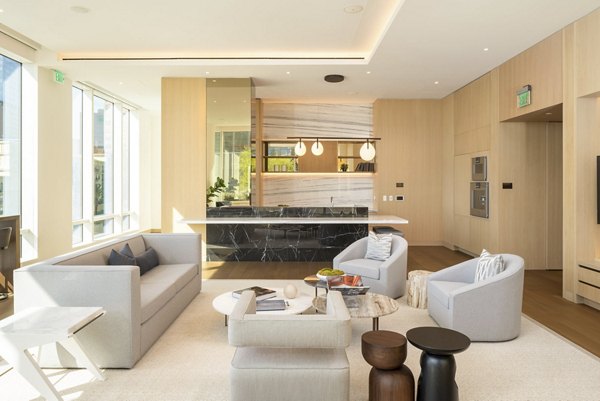 Clubhouse with modern design and elegant seating at THEA at Metropolis Apartments