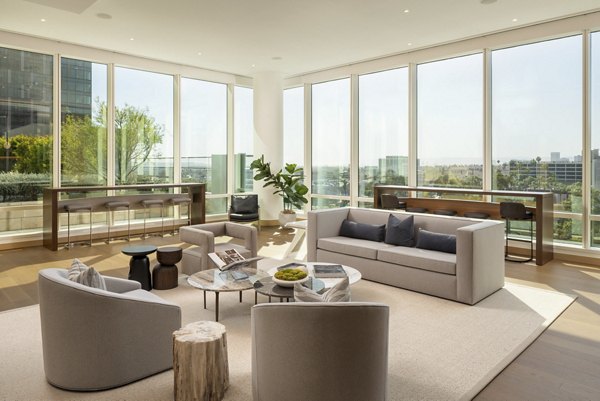 Modern clubhouse with stylish decor at THEA at Metropolis Apartments, offering luxury amenities and social spaces in downtown Los Angeles