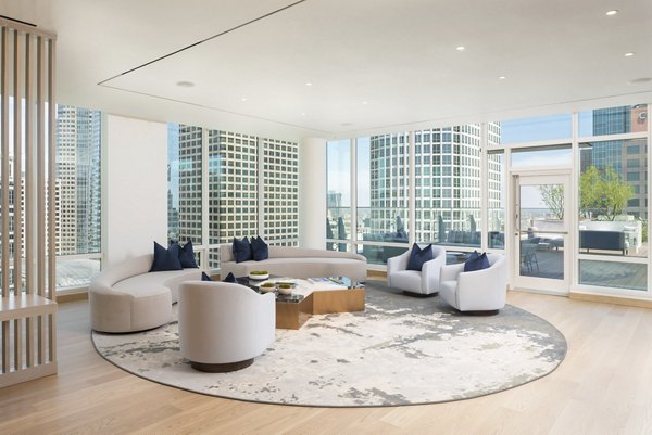Clubhouse at THEA: Luxurious clubhouse featuring modern decor at Metropolis Apartments in Los Angeles, CA.