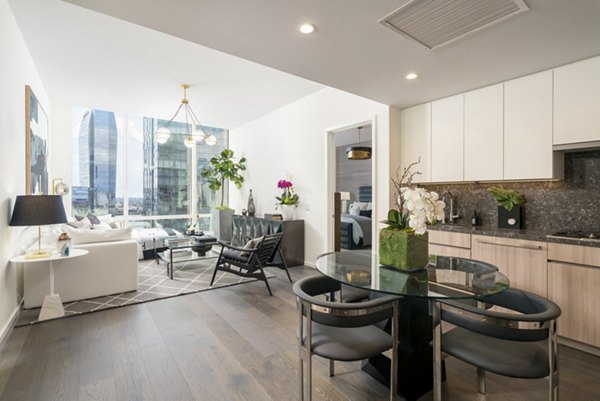 Contemporary dining area with sleek furnishings at THEA at Metropolis Apartments