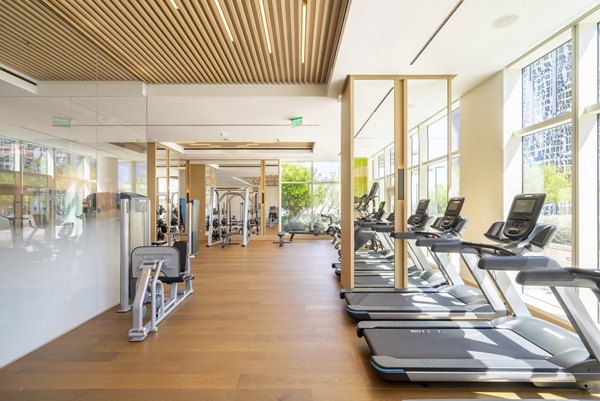 State-of-the-art fitness center with modern equipment at THEA at Metropolis Apartments