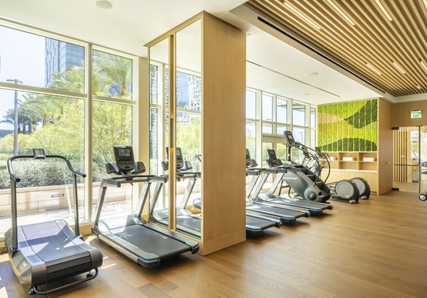 Modern fitness center with state-of-the-art equipment at THEA at Metropolis Apartments