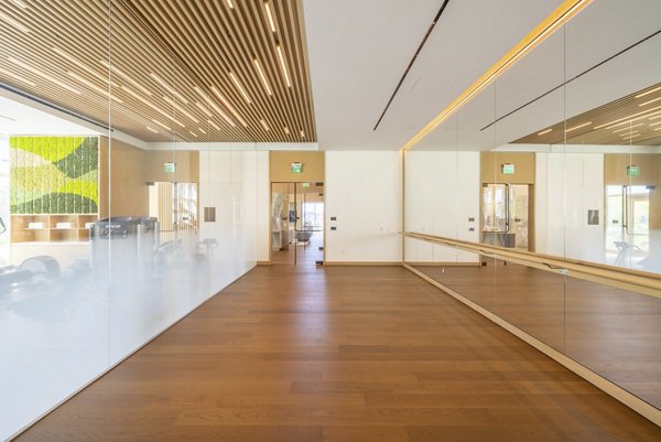Yoga and spin studio with modern equipment at THEA at Metropolis Apartments