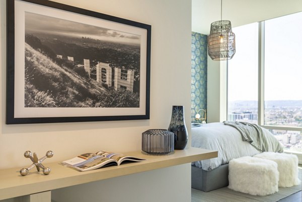 Spacious modern kitchen with sleek marble countertops in THEA at Metropolis Apartments, a luxury Greystar property