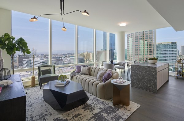 Modern living room with stylish decor at THEA in Metropolis Apartments, showcasing luxury living for urban residents