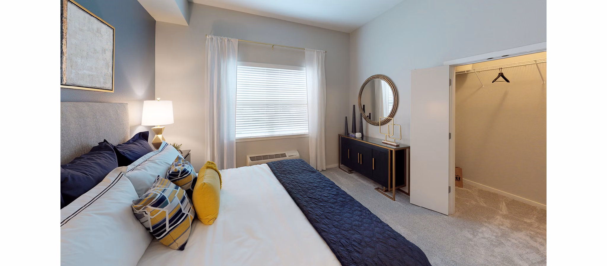Bedroom featuring elegant modern furnishings at Nexus at Orenco Station Apartments