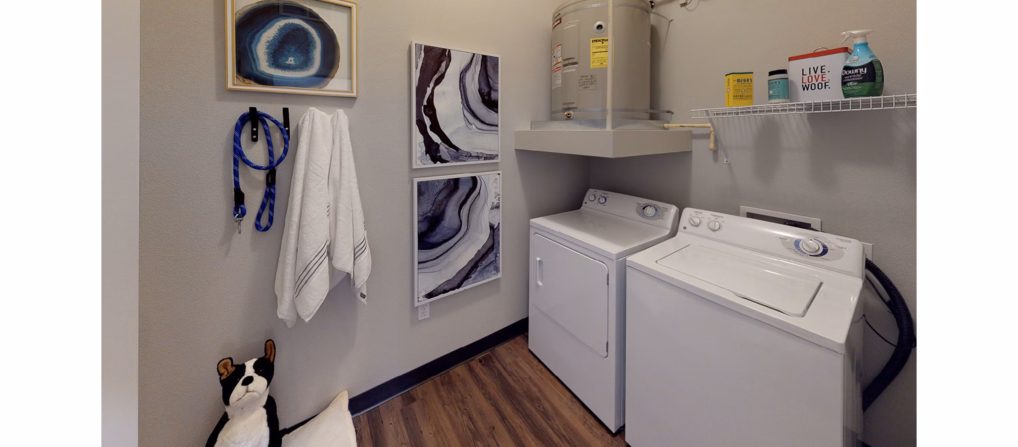 Laundry room with modern appliances at Nexus at Orenco Station Apartments