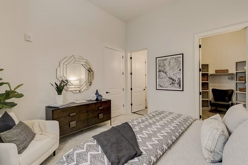 Cozy bedroom with modern decor at Addison Grove Apartments, perfect for luxury living