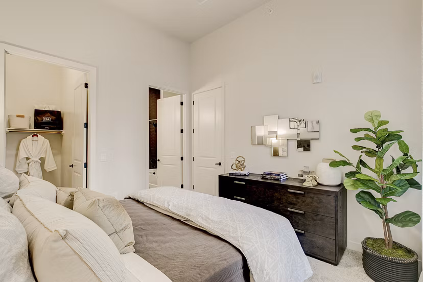 Modern bedroom with elegant decor at Addison Grove luxury apartments
