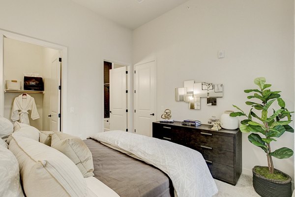 Modern bedroom with elegant decor at Addison Grove luxury apartments