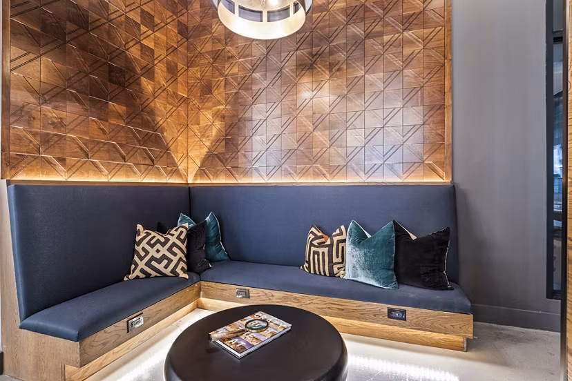 Lobby area featuring modern seating and decor at Elan Addison Grove Apartments, luxury community