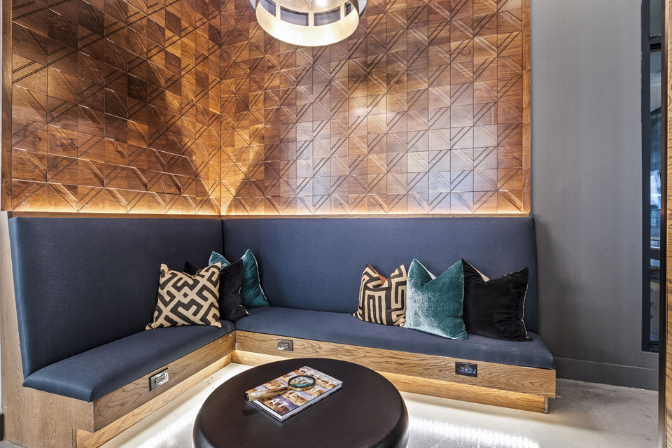 Lobby area featuring modern seating and decor at Elan Addison Grove Apartments, luxury community