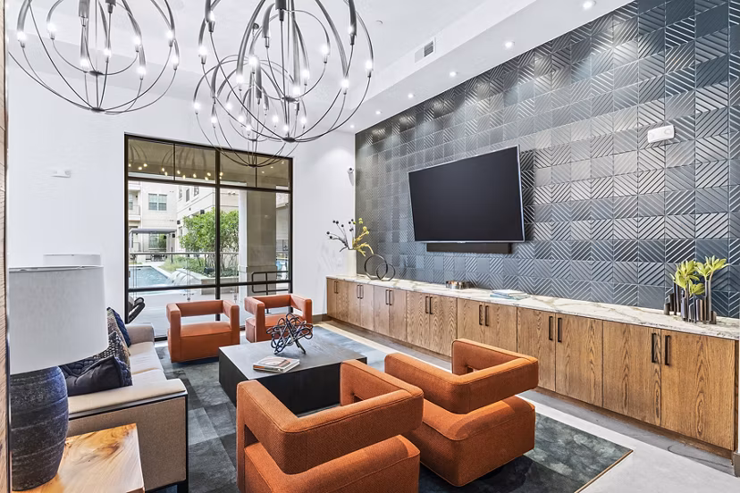 Welcoming clubhouse lobby with modern seating at Elan Addison Grove Apartments, perfect for community gatherings and relaxation