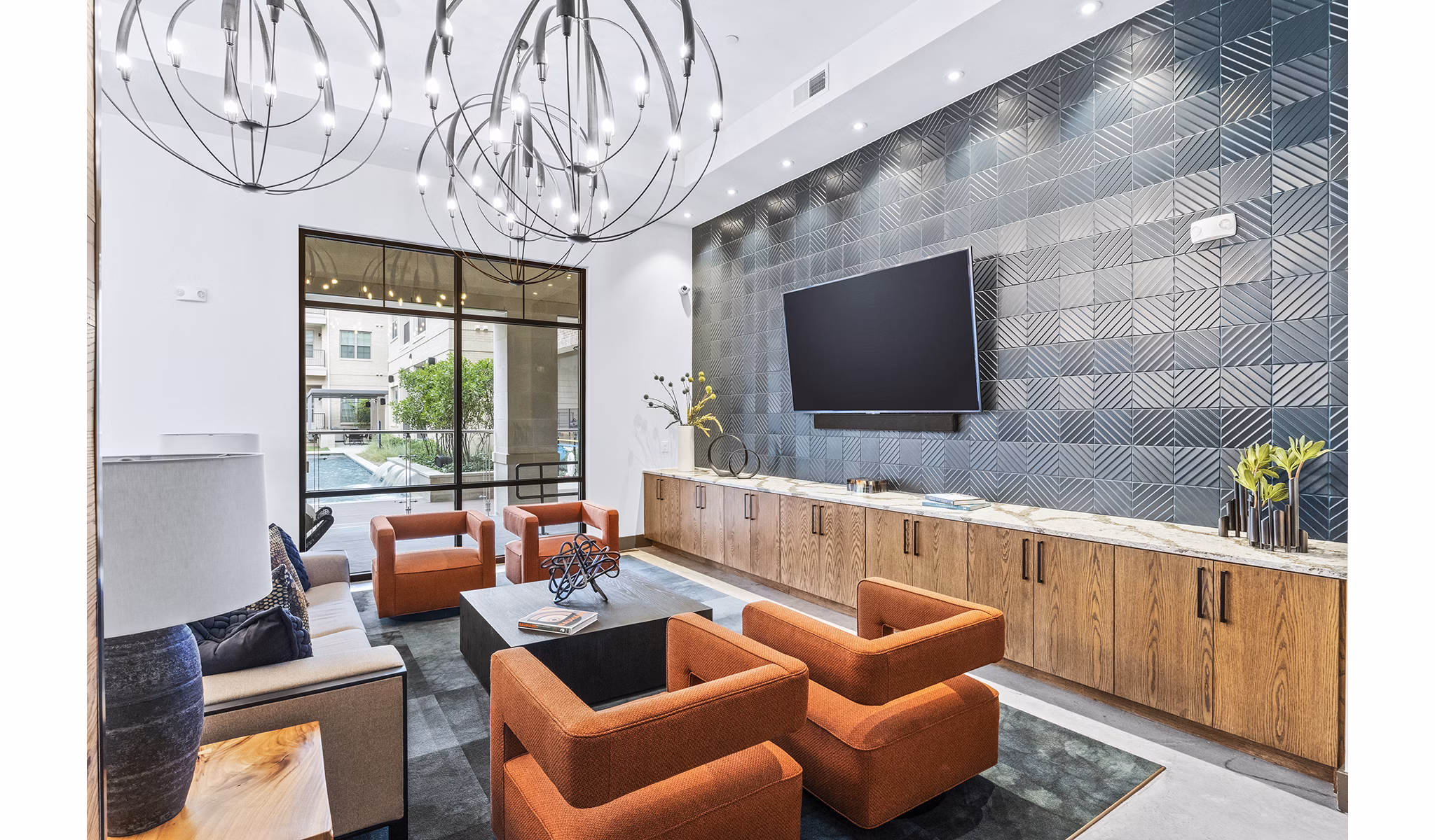 Welcoming clubhouse lobby with modern seating at Elan Addison Grove Apartments, perfect for community gatherings and relaxation