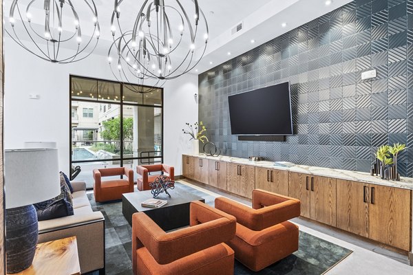 Welcoming clubhouse lobby with modern seating at Elan Addison Grove Apartments, perfect for community gatherings and relaxation
